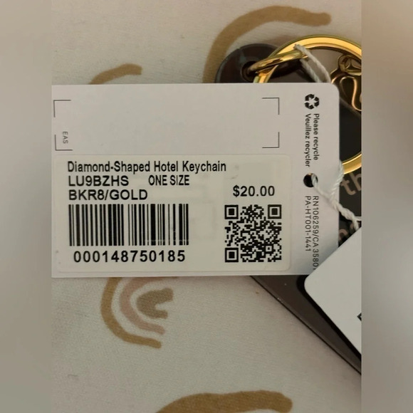 NWT Diamond Shaped Hotel keychain in roasted brown still has plastic on it. - Picture 5 of 5